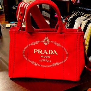 Canvas red Prada purse.